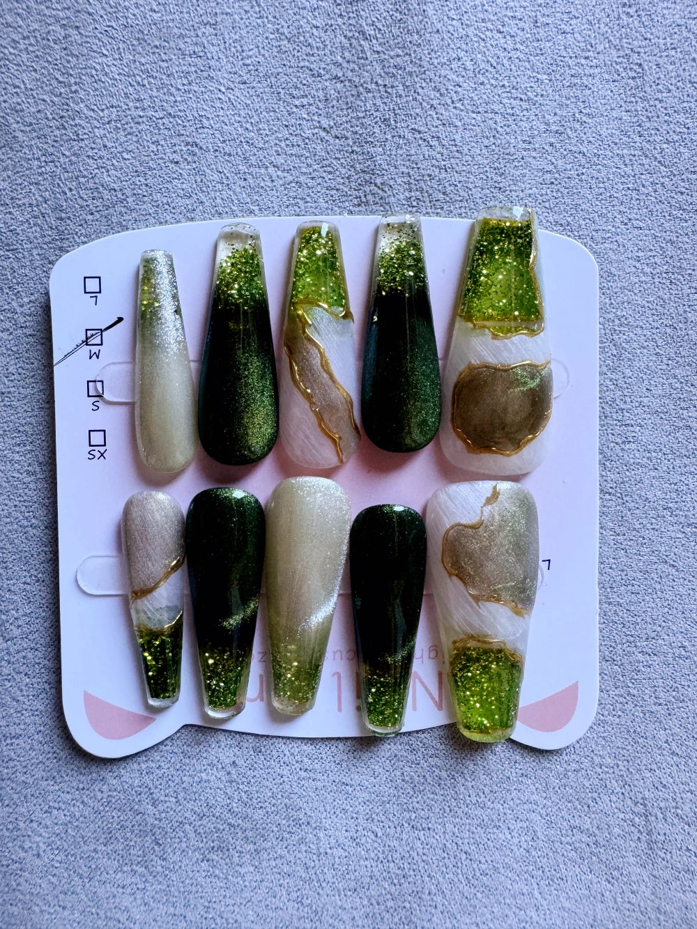 Emerald Pool Hand Drawn Elaborate Satin Gold Outline Emerald Cat Eye Flowing Sand Nail Art